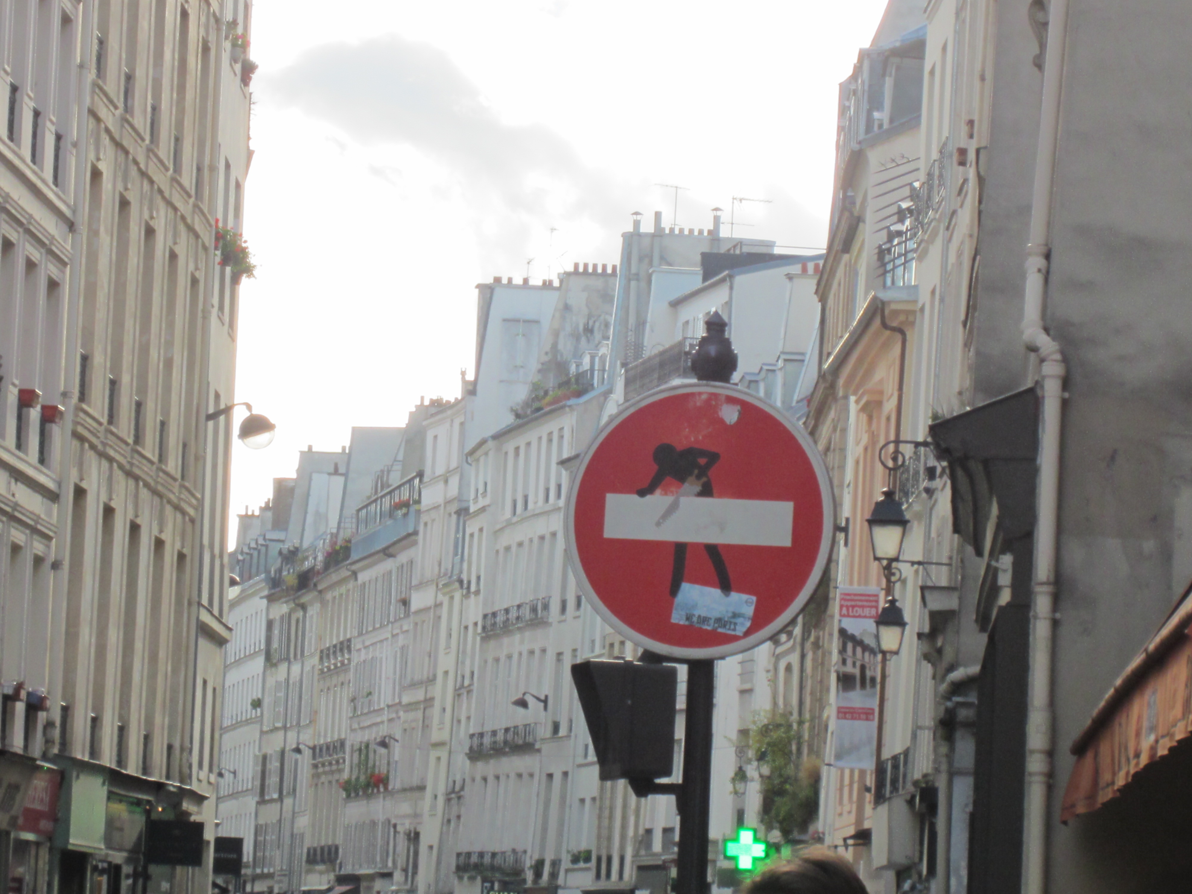 modified street sign with a stick figure