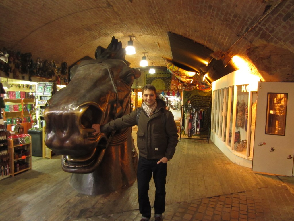 Derrick poses with a big horse head. Duh.
