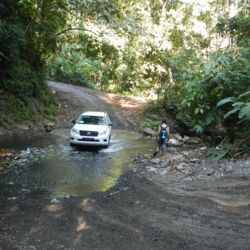 Car crossing a river in Costa Rica Puerto jiminez