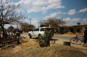 a 4x4 parked on the road in africa