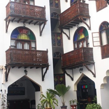 stained glass windows and a swimming pool at a zanzibar hotel