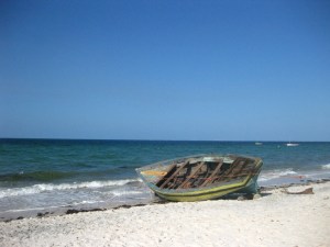 Inhassoro beach with a small wooden boat
